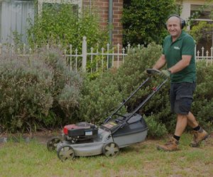 A Fanastic gardener mowing a lawn